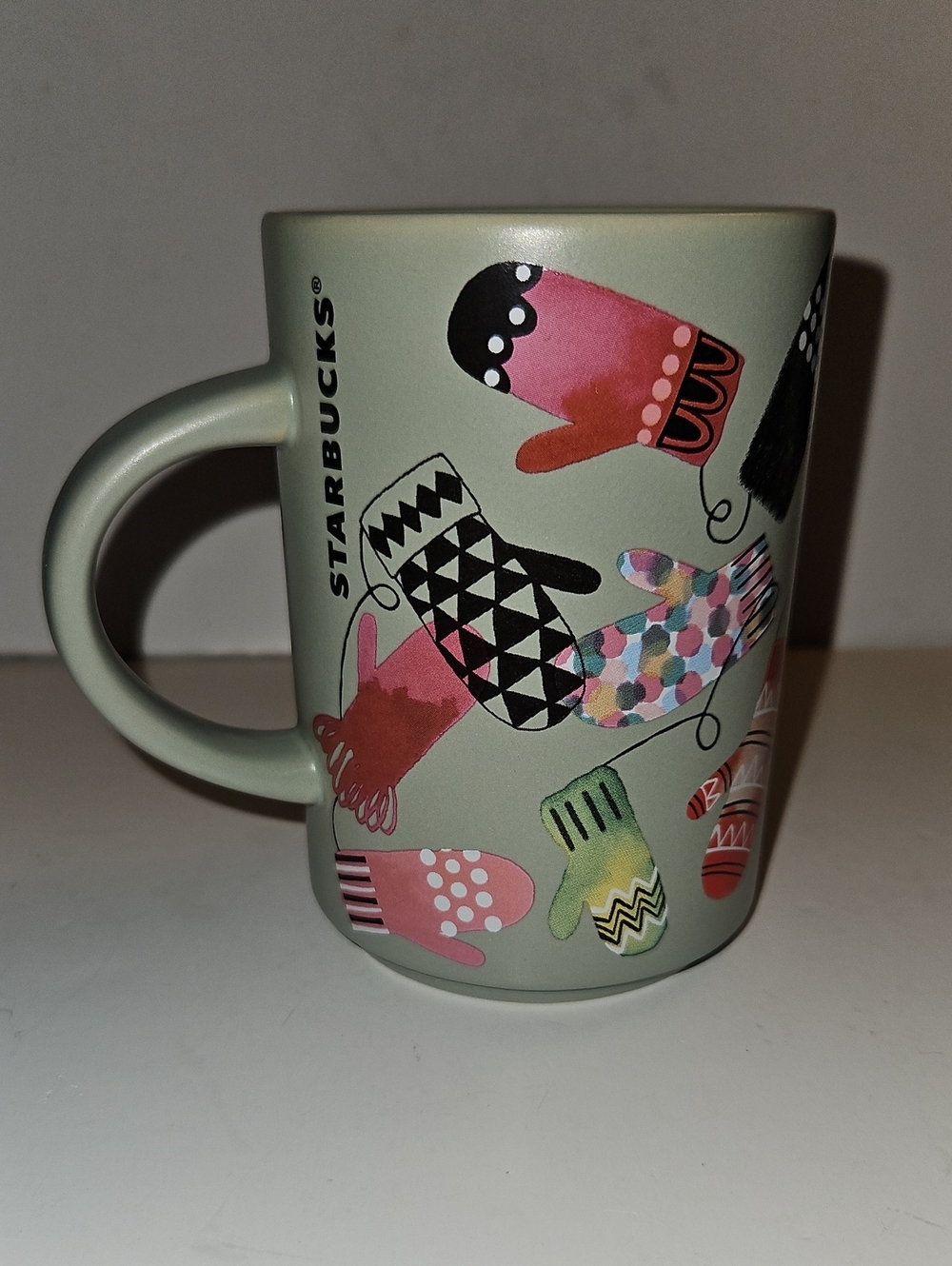 STARBUCKS 2017 MITTENS , WINTER COFFEE MUG 12 OZ. SAGE GREEN